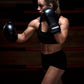 Woman wearing Kruzak Black boxing gloves
