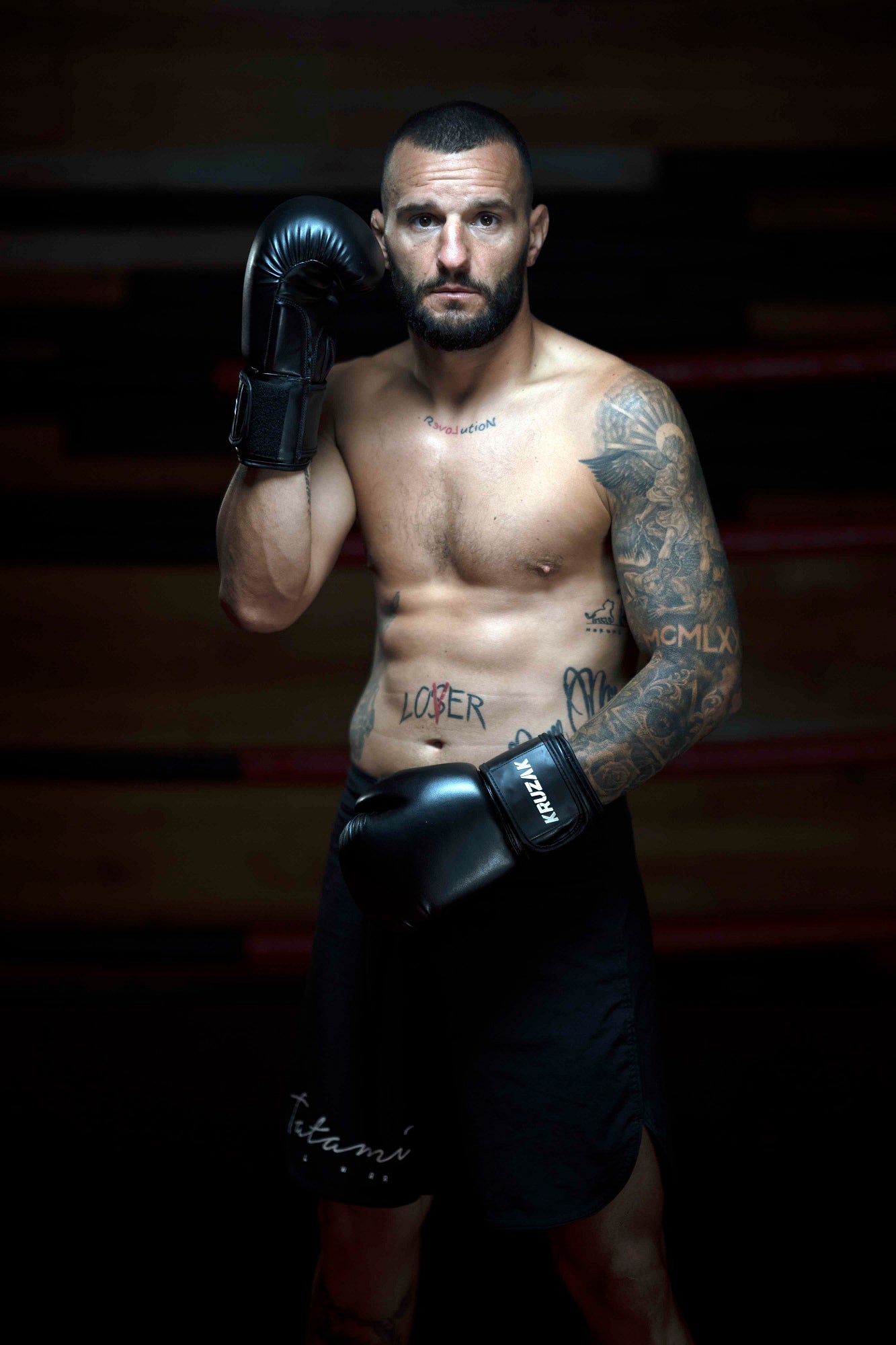 Man wearing  Kruzak Unisex Black Boxing Gloves