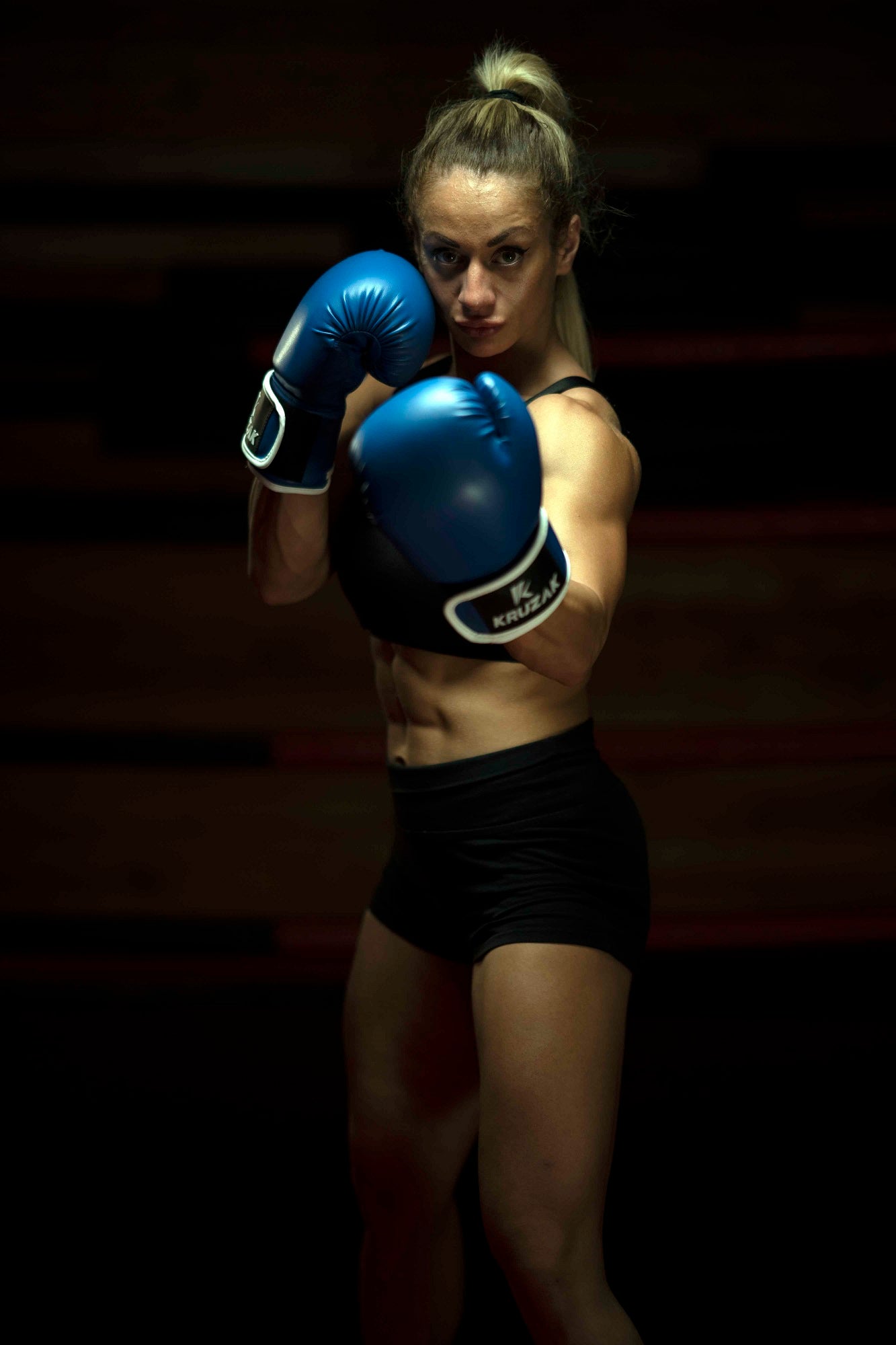 Woman wearing  Kruzak Unisex Blue Boxing Gloves