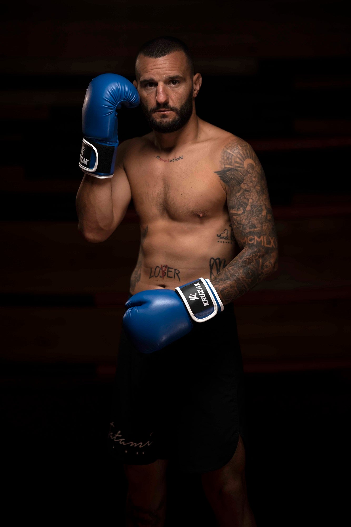 Man wearing  Kruzak Unisex Blue Boxing Gloves