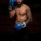 Man wearing Kruzak Blue boxing gloves