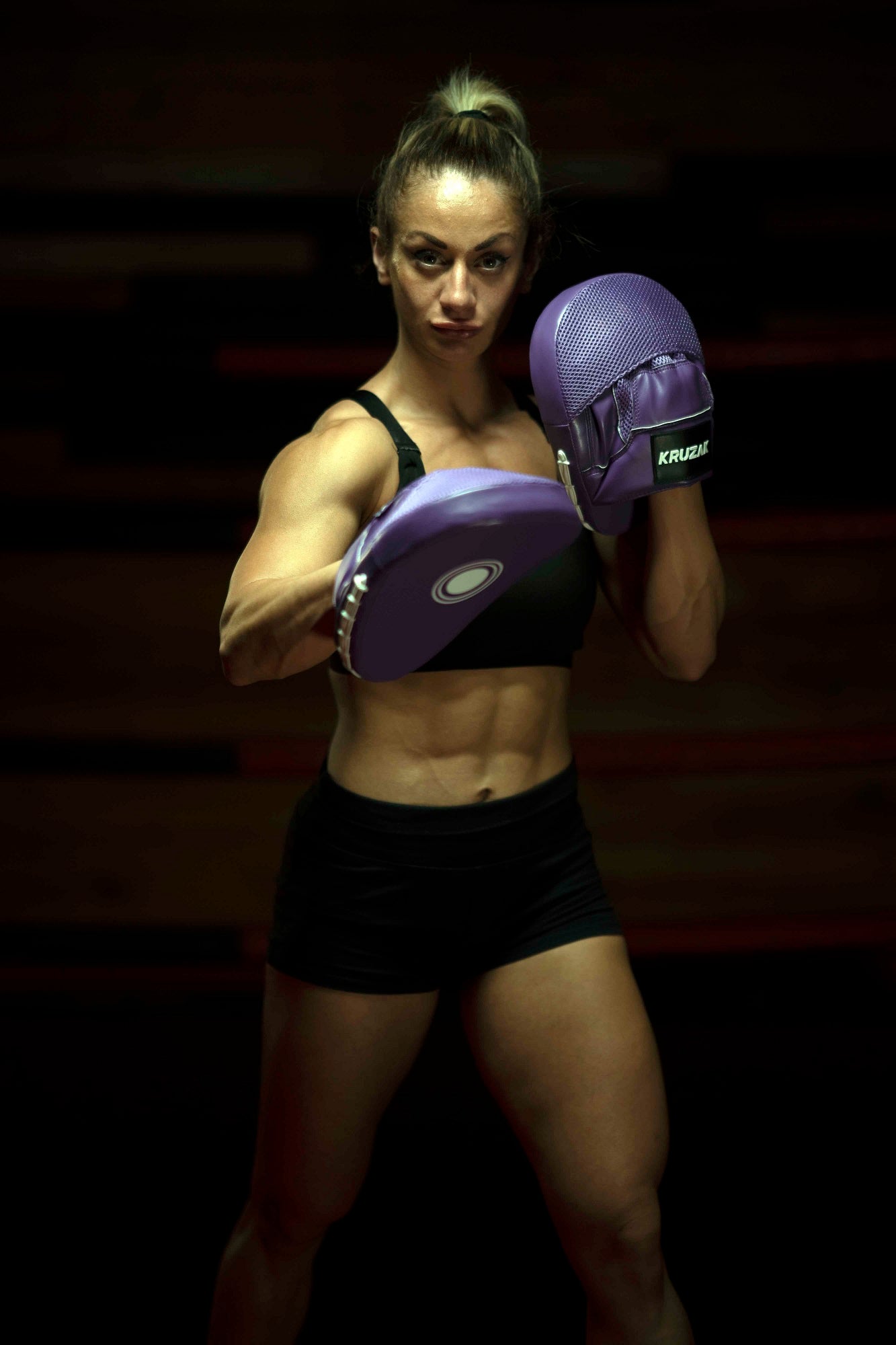 Woman wearing Kruzak Unisex Purple Focus Pads