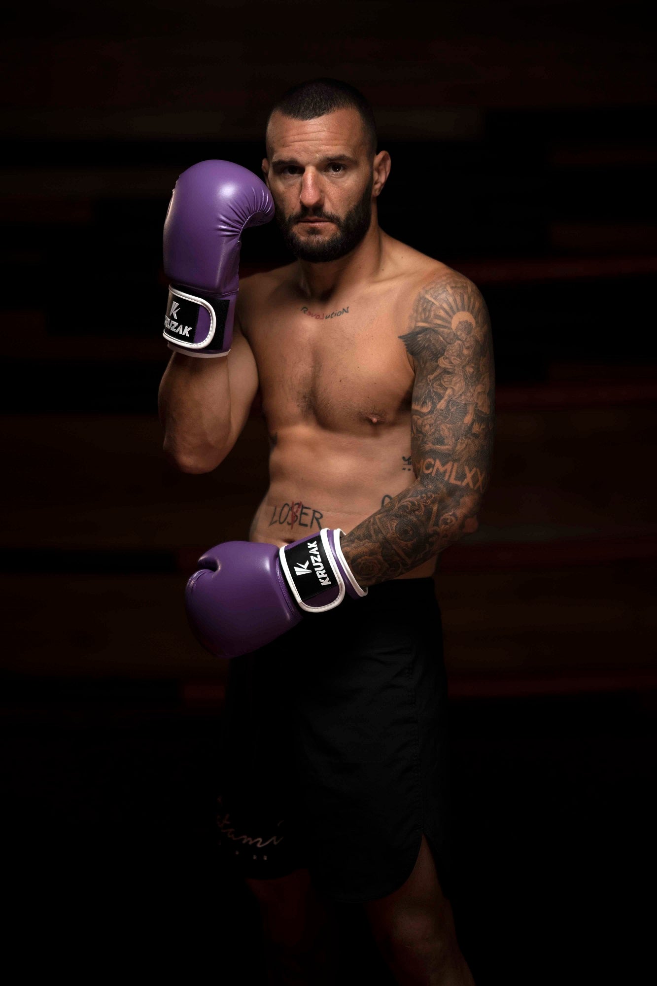 Man wearing Kruzak Unisex Purple Boxing Gloves