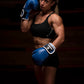 Woman wearing Kruzak Blue boxing gloves