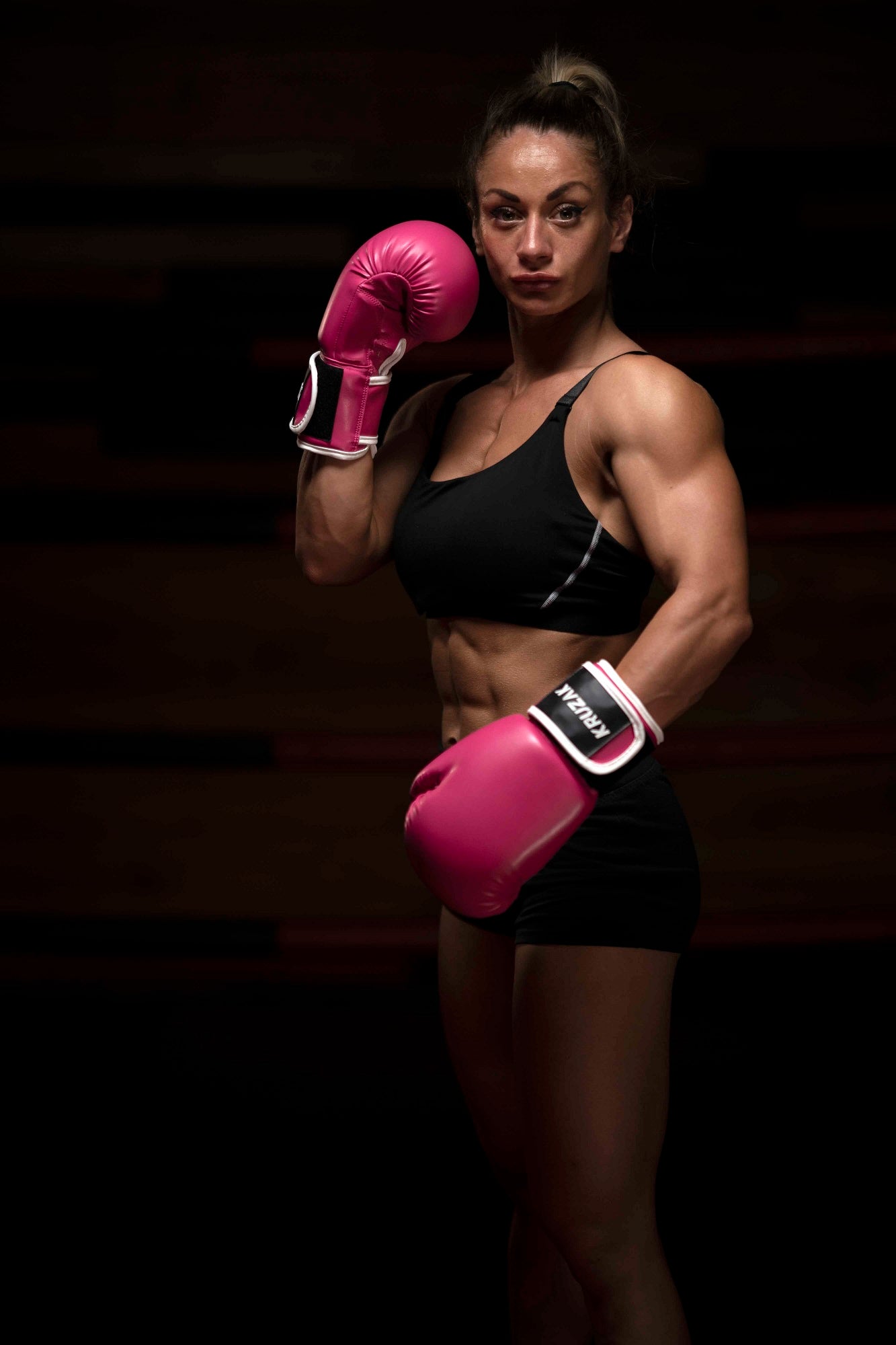 Woman wearing Kruzak Pink boxing gloves