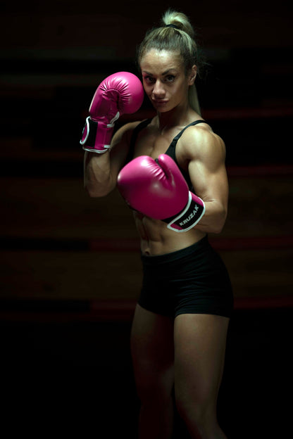Woman wearing Kruzak Pink boxing gloves