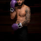 Man wearing Kruzak Unisex Purple Boxing Gloves