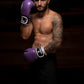 Man wearing Kruzak Purple boxing gloves