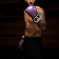 Man wearing Kruzak Purple boxing gloves