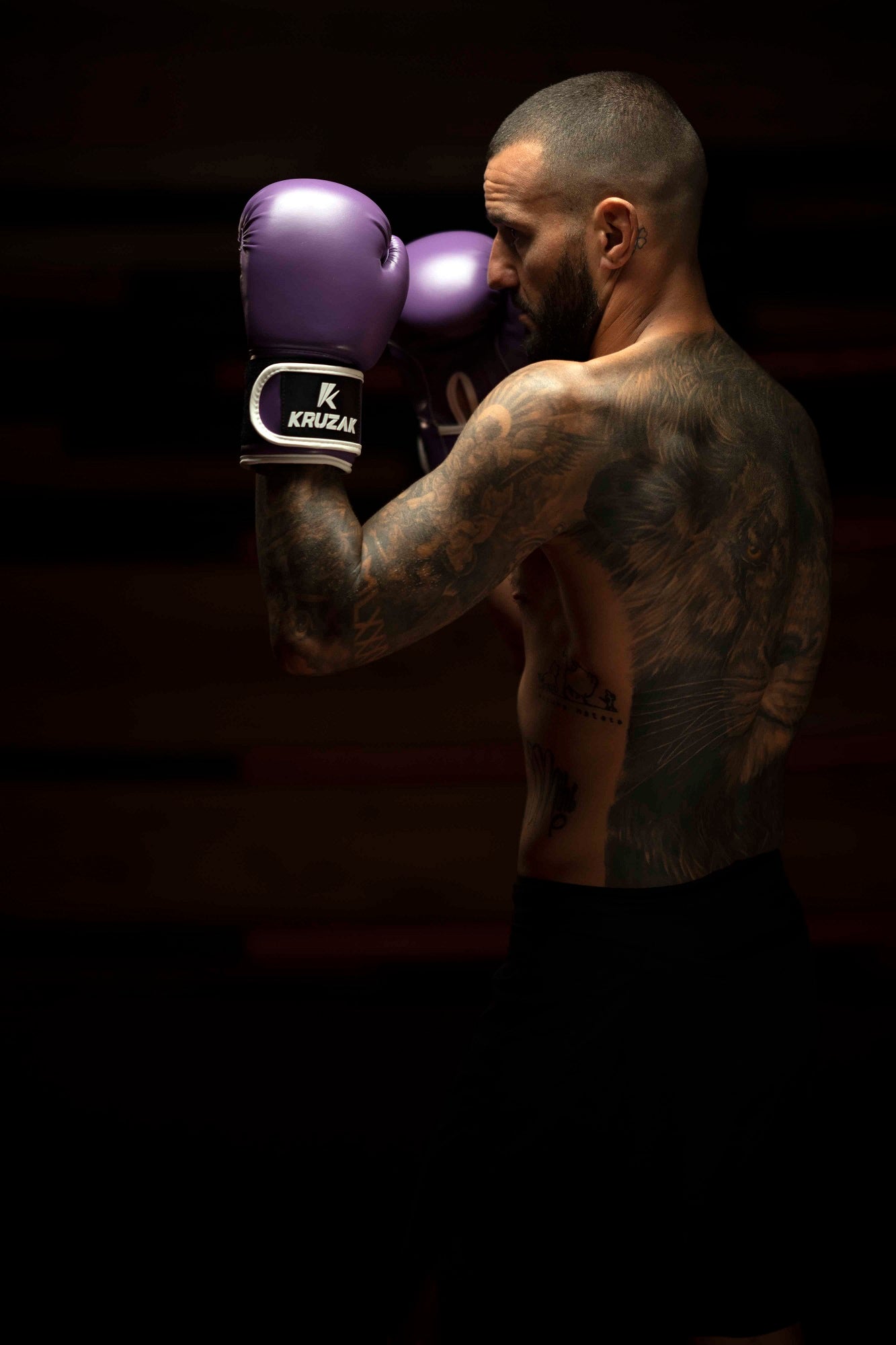 Man wearing  Kruzak Unisex Purple Boxing Gloves