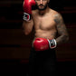 Man wearing Kruzak Red boxing gloves